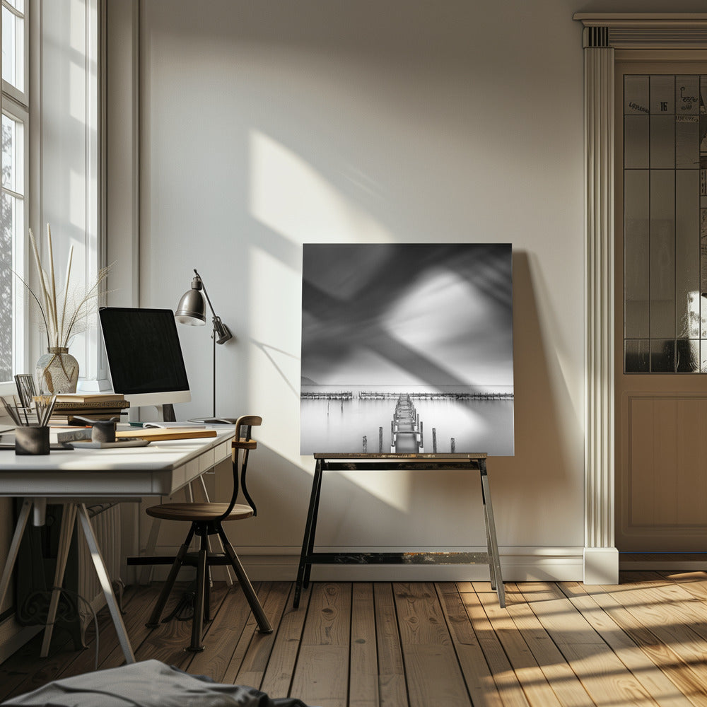 A framed, square black and white long-exposure photograph of a dilapidated wooden pier extending into calm, misty water. The sky is filled with soft, streaked clouds, creating a serene and melancholic mood. Wall Art