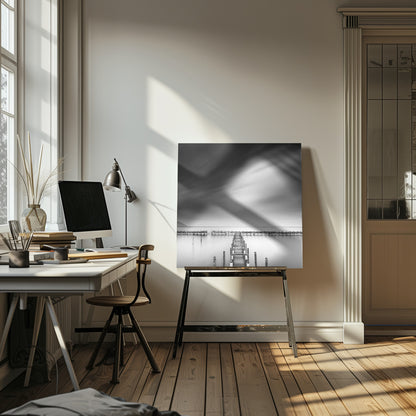 A framed, square black and white long-exposure photograph of a dilapidated wooden pier extending into calm, misty water. The sky is filled with soft, streaked clouds, creating a serene and melancholic mood. Wall Art