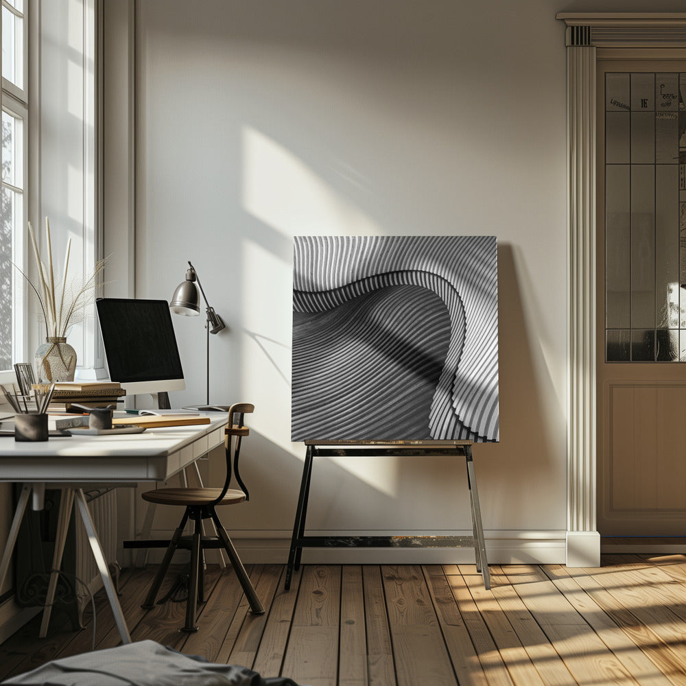 A square, black and white abstract photograph in a light wood frame. The image features layers of flowing, curved surfaces with parallel grooves, creating a strong sense of texture and depth. Lighter, striped layers with vertical lines curve over a darker, undulating section, resembling waves or sculpted wood, drawing the eye into a central dark crevice. Decor