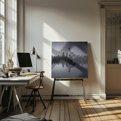 A framed, moody black and white photograph of the Lower Manhattan skyline, featuring the One World Trade Center, with a perfect, still reflection of the skyscrapers in the water below. Decor