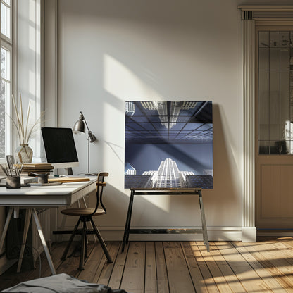 A framed, low-angle photograph capturing a stark white skyscraper against a deep blue sky, with its perfect reflection mirrored in the dark glass facade of an overhanging building, creating a surreal and symmetrical composition. Wall Art