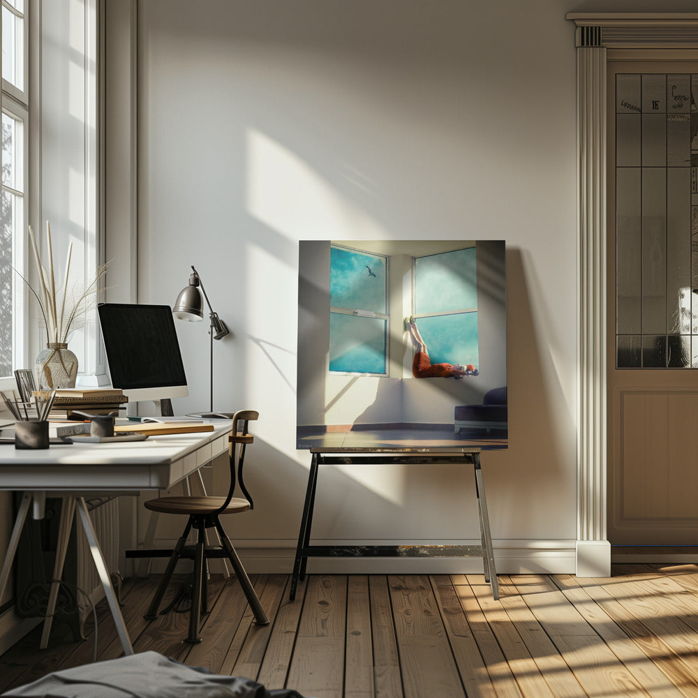 A surreal photograph of a woman in a bright orange dress lying on a wide, sunlit windowsill with her legs up against the wall. Through the large windows, a single bird is seen flying in a vibrant teal sky. The image, presented in a light wood frame, captures a moment of quiet contemplation and escape. Wall Art