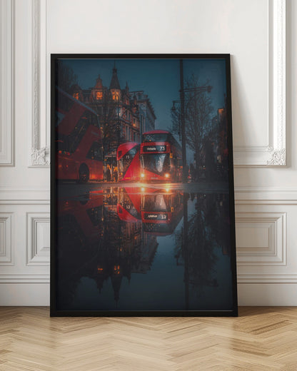 A moody, low-angle photograph of a wet London street at dusk, with a vibrant red double-decker bus reflected perfectly in a large puddle in the foreground. Print