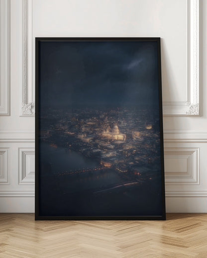 An atmospheric aerial view of London at night, with the illuminated St. Paul's Cathedral as the central focus. The sprawling cityscape glows with warm lights against a dark, stormy sky, while the River Thames flows in the foreground. Wall Art