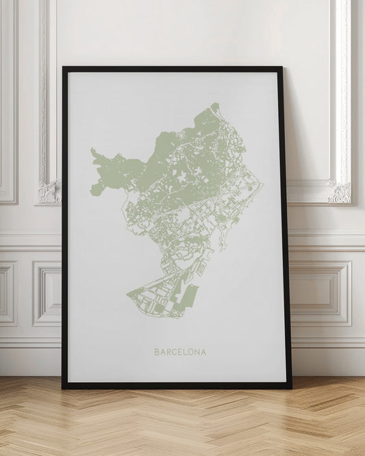 A minimalist art print of a Barcelona city map, rendered in a pale sage green on a white background. The print is framed in a simple black frame, with the city's name 'BARCELONA' typed at the bottom. Poster