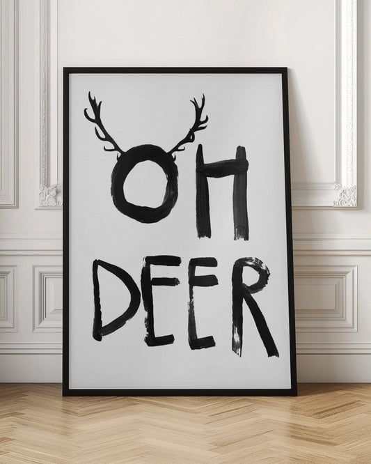 A black and white minimalist art print featuring the phrase 'OH DEER' painted in a bold, black brushstroke font. The letter 'O' is playfully adorned with a pair of deer antlers, creating a visual pun. Decor
