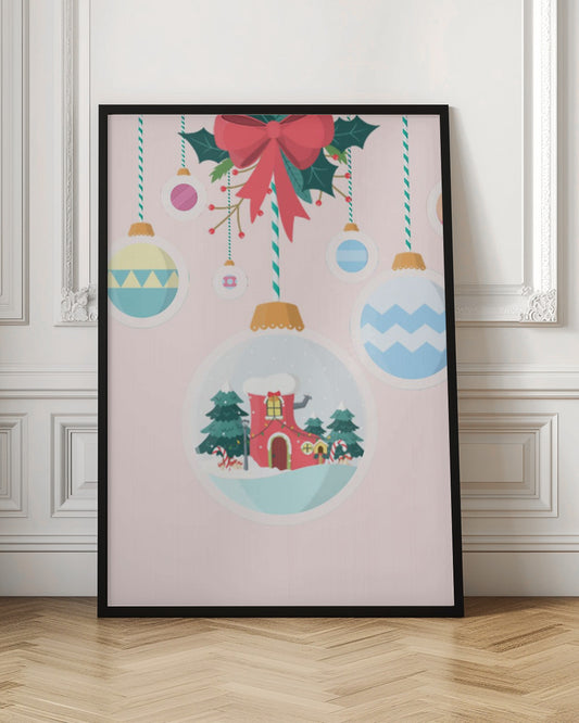 A festive Christmas illustration featuring hanging ornaments against a soft pink background. A large central ornament depicts a charming winter scene with a red, boot-shaped house covered in snow, nestled among pine trees. Other colorful, patterned baubles hang from striped strings, all under a large red bow with holly. Decor