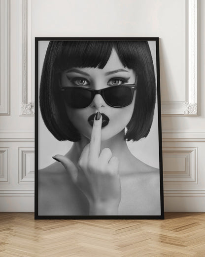 A striking black and white portrait of a woman with a sharp bob haircut, sunglasses, and bold makeup. She holds one finger with a black-painted nail up to her dark lips, making a 'shushing' gesture. Poster