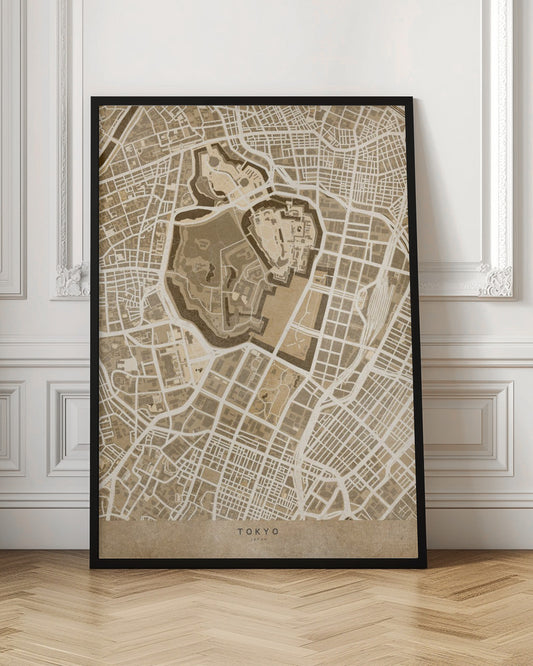 A vintage-style, framed map of Tokyo, Japan, in shades of brown and beige. The map showcases the city's intricate street grid with a focus on a central fortified area, likely the Imperial Palace. The words 'TOKYO' and 'JAPAN' are written at the bottom. Print