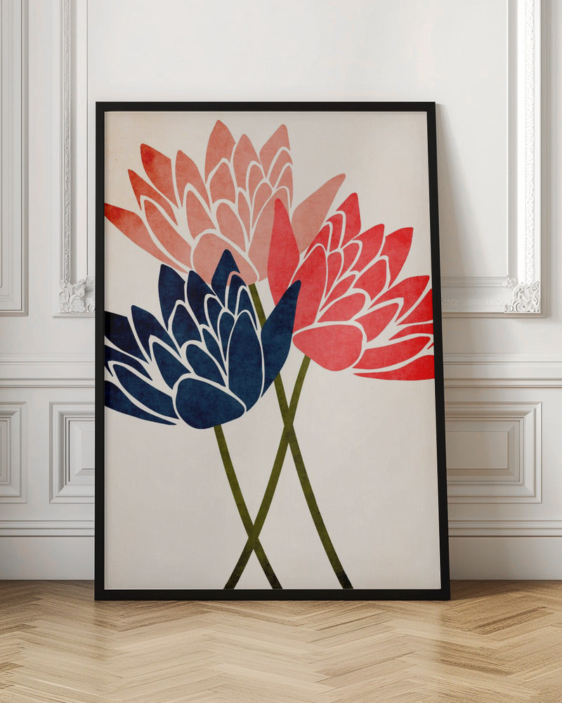 A modern graphic art print of three stylized flowers in navy blue, coral red, and salmon pink against a textured off-white background, all enclosed in a thin black frame. The flower petals have white outlines, and their dark green stems cross at the bottom. Artwork