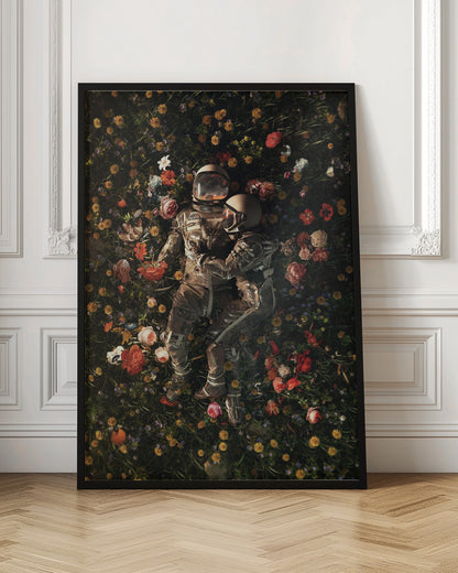 An overhead view of two astronauts in full gear, embracing each other while lying down in a lush, dark field filled with a vibrant array of colorful flowers. Wall Art
