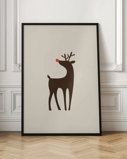 A minimalist art print of a stylized brown reindeer with a bright red nose, standing in profile against a cream-colored background, all enclosed in a simple black frame. Print