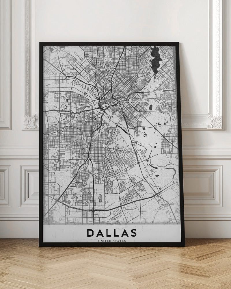A minimalist black and white street map of Dallas, Texas, presented vertically in a black frame. The intricate network of roads and highways is depicted in black lines on a light gray, textured background, with the city's name 'DALLAS' in bold capital letters at the bottom. Poster