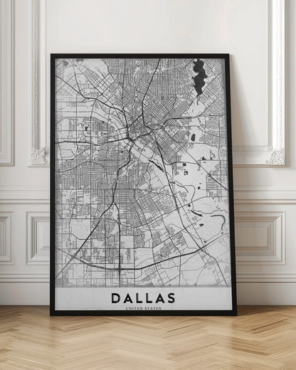 A minimalist black and white street map of Dallas, Texas, presented vertically in a black frame. The intricate network of roads and highways is depicted in black lines on a light gray, textured background, with the city's name 'DALLAS' in bold capital letters at the bottom. Poster