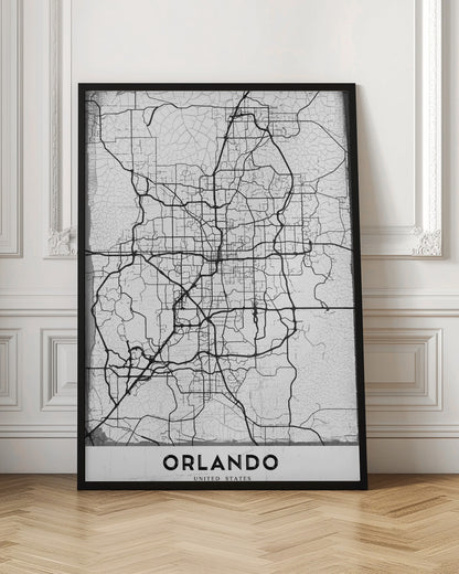 A minimalist black and white street map of Orlando, Florida, displayed in a black frame. The map consists of black lines representing the city's road network on a distressed, crackled white background. At the bottom, the word 'ORLANDO' is printed in a bold, black, sans-serif font on a white banner. Poster