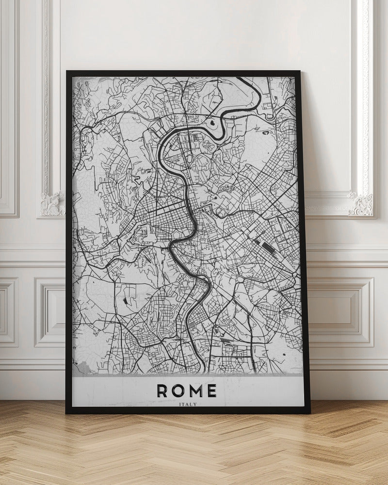 A minimalist black and white art print of a street map of Rome, Italy. The map shows the winding Tiber River flowing through the dense grid of city streets. The poster has a simple black frame and the word 'ROME' is printed in a bold, sans-serif font at the bottom. Print