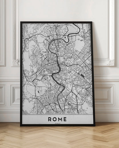 A minimalist black and white art print of a street map of Rome, Italy. The map shows the winding Tiber River flowing through the dense grid of city streets. The poster has a simple black frame and the word 'ROME' is printed in a bold, sans-serif font at the bottom. Print