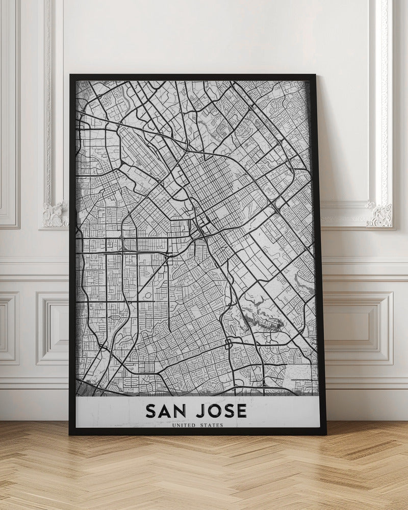 A minimalist black and white street map of San Jose, California, presented as a framed poster. The map details the city's grid, highways, and roads in black lines on a slightly textured white background. The text 'SAN JOSE' is written in a bold, black, sans-serif font at the bottom. Wall Art