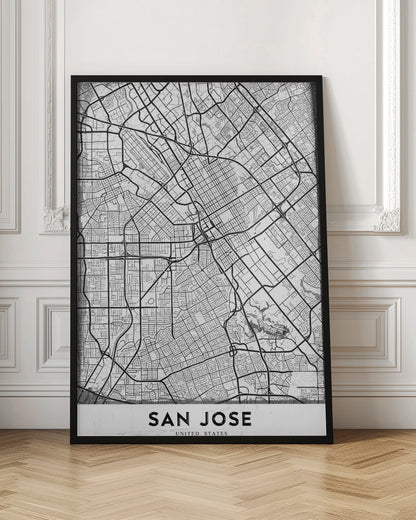 A minimalist black and white street map of San Jose, California, presented as a framed poster. The map details the city's grid, highways, and roads in black lines on a slightly textured white background. The text 'SAN JOSE' is written in a bold, black, sans-serif font at the bottom. Wall Art