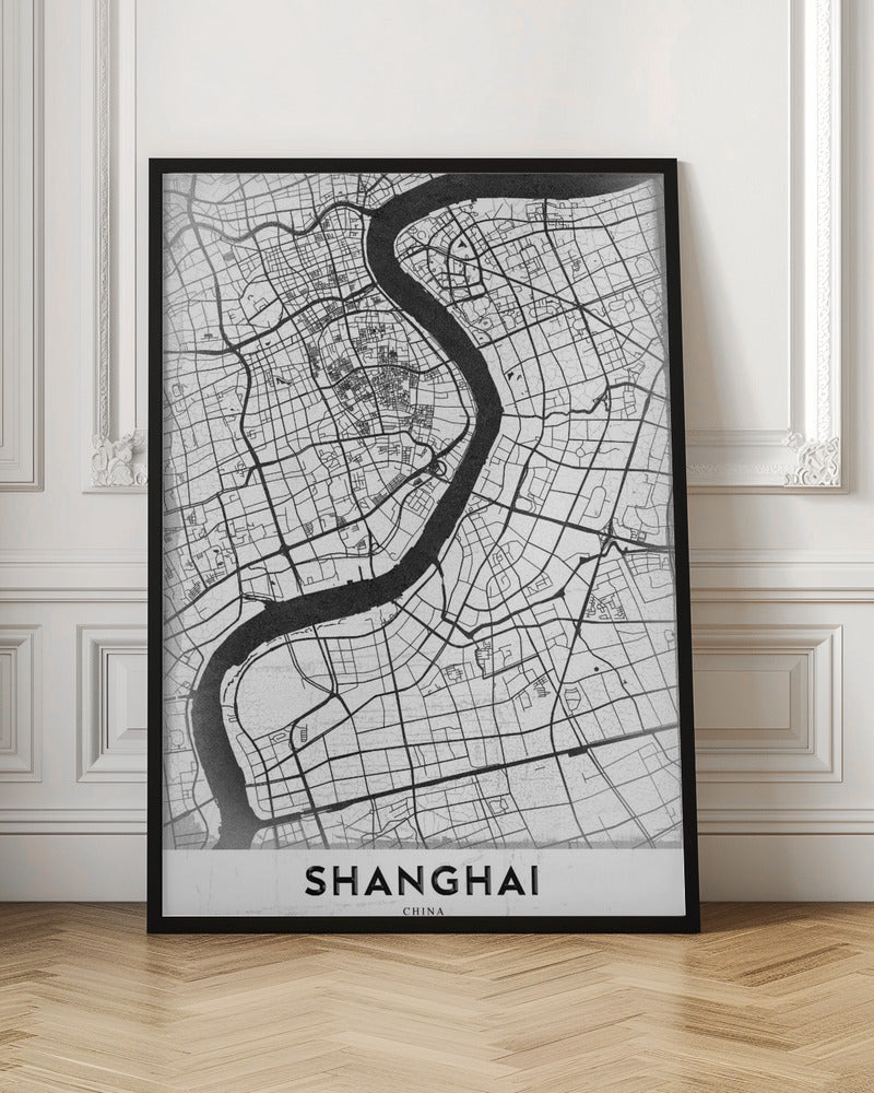 A minimalist black and white street map of Shanghai in a black frame. The map highlights the city's road network and the prominent Huangpu River, with the name 'SHANGHAI' printed at the bottom. Decor