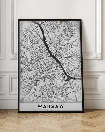 A minimalist black and white street map of Warsaw, Poland, displayed in a black frame. The map details the intricate network of roads and the Vistula River, with the city's name 'WARSAW' printed in a bold, black, sans-serif font at the bottom. Print