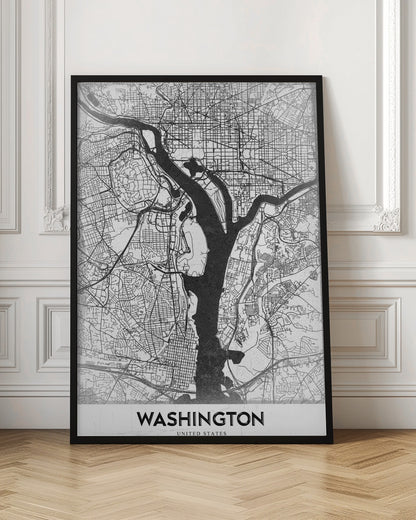 A modern, minimalist black and white map of Washington, D.C., presented as a framed poster. The Potomac and Anacostia rivers are shown in solid black, contrasting with the intricate thin black lines of the city's street grid on a white textured background. The word 'WASHINGTON' is centered at the bottom in bold black text. Artwork