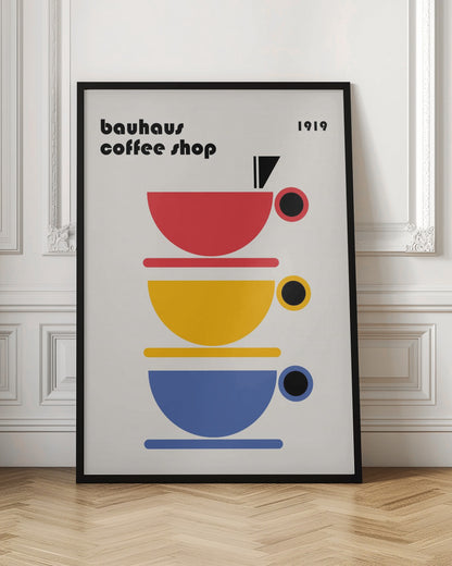 A minimalist Bauhaus-style poster titled 'bauhaus coffee shop 1919'. The artwork features a vertical stack of three stylized coffee cups in primary colors—red, yellow, and blue—on a light cream background, all rendered in simple geometric shapes. Poster
