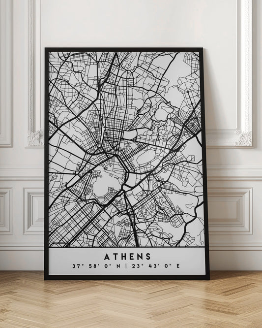 A minimalist black and white poster of a street map of Athens, Greece, enclosed in a simple black frame. The map consists of intricate black lines on a white background, showing the city's road network. At the bottom, centered, is the text 'ATHENS' in a bold, uppercase font, with its geographical coordinates '37° 58' 0" N | 23° 43' 0" E' listed below. Poster