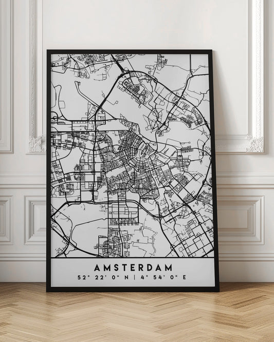 A minimalist black and white line art map of Amsterdam, Netherlands, in a black frame. The map details the intricate network of streets and canals. Below the map, the city's name 'AMSTERDAM' is printed in a bold, sans-serif font, with its geographical coordinates '52° 22' 0" N | 4° 54' 0" E' underneath. Poster