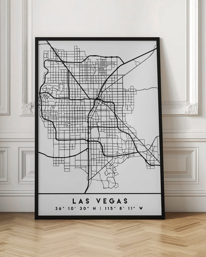 A minimalist black and white framed map of Las Vegas, showcasing the city's street grid and major highways. Below the map, the city's name and geographical coordinates are printed in a clean, modern font. Poster
