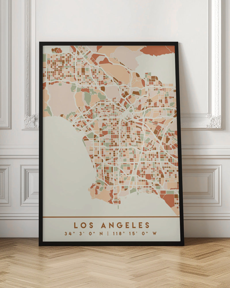 A stylized, block-pattern map of Los Angeles in a warm, earthy color palette of terracotta, brown, and sage green on a cream background. The poster is framed in black and includes the text 'LOS ANGELES' with its geographic coordinates at the bottom. Print