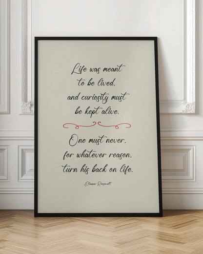 A framed inspirational quote by Eleanor Roosevelt in a black cursive font on a textured beige background. The quote reads: 'Life was meant to be lived, and curiosity must be kept alive. One must never, for whatever reason, turn his back on life.' A red decorative flourish separates the two stanzas. Decor