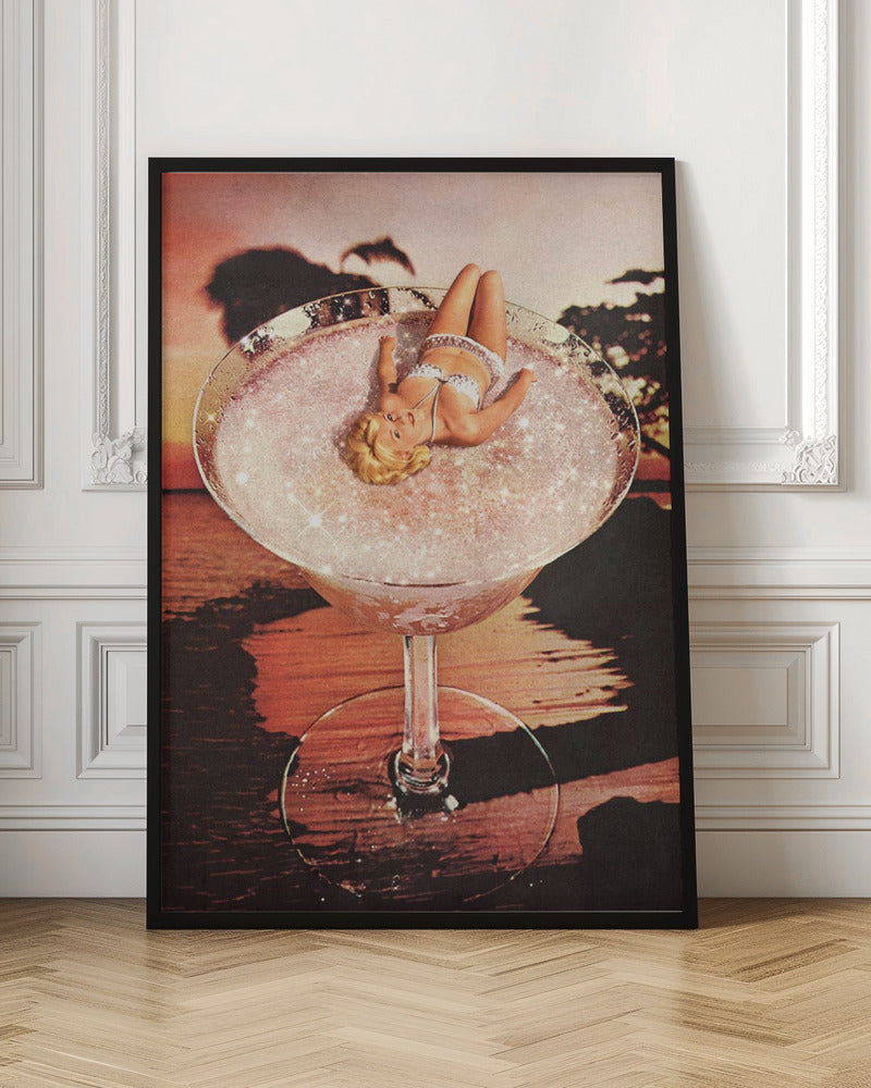 A surreal collage featuring a blonde woman in a white bikini lounging in a giant cocktail glass filled with a sparkling pink liquid, set against a warm sunset over the ocean. Print