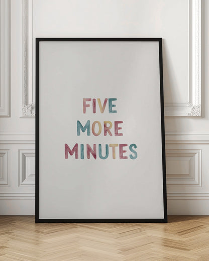 A framed art print with the text 'FIVE MORE MINUTES' in a colorful watercolor style against a white background. The words are arranged vertically, and the print is housed in a simple black frame. Wall Art