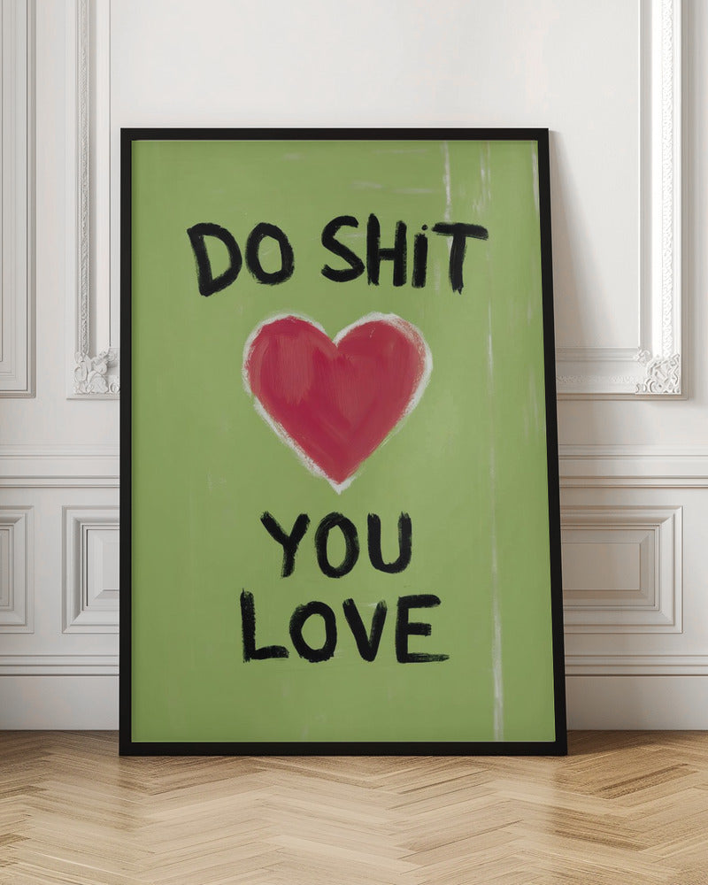 A framed modern art print with a light green background featuring the motivational phrase 'DO SHIT YOU LOVE' in black, hand-painted letters. A large, stylized red heart is painted between the top and bottom lines of text. Print