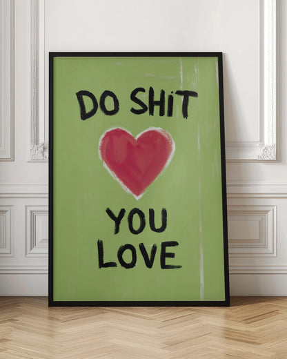 A framed modern art print with a light green background featuring the motivational phrase 'DO SHIT YOU LOVE' in black, hand-painted letters. A large, stylized red heart is painted between the top and bottom lines of text. Print