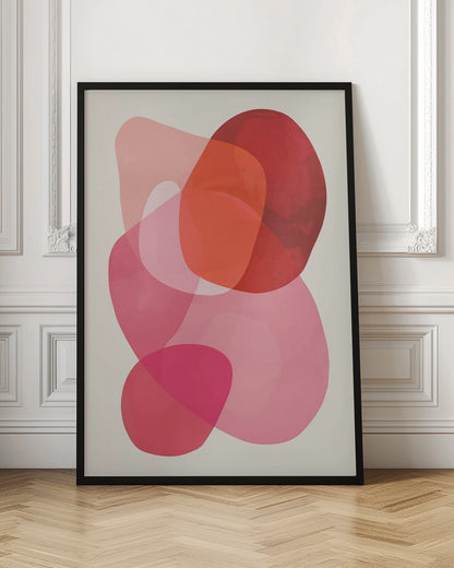 An abstract art print in a black frame, featuring a composition of overlapping, translucent, organic shapes in shades of red, orange, and pink on an off-white background. Print