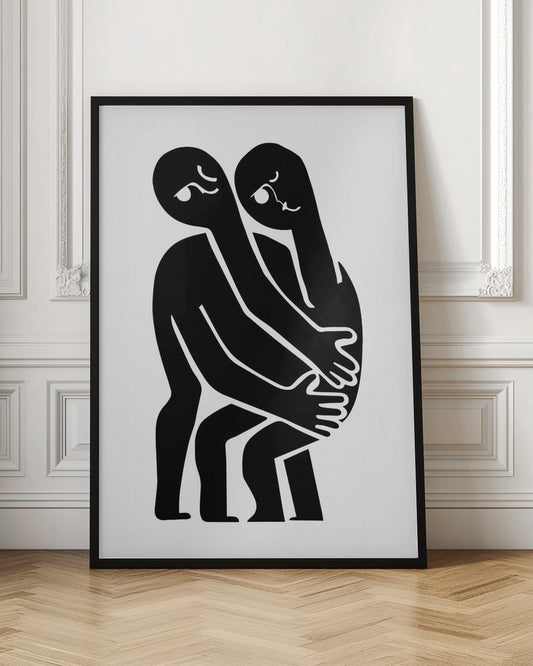 A minimalist black and white art print featuring two abstract, stylized figures in a close embrace. The figures are rendered in solid black against a plain white background, with their elongated limbs and bodies intertwined. Simple white lines within the black silhouettes create expressive facial features. The artwork is contained within a thin black frame. Wall Art
