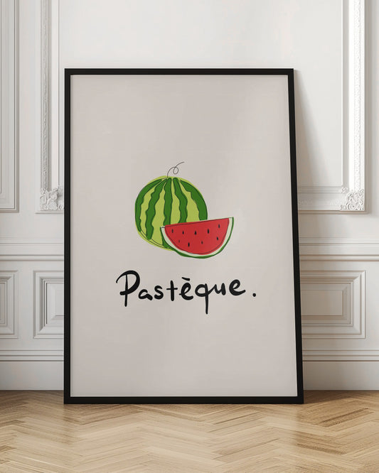 A framed art print featuring a simple, stylized illustration of a whole watermelon and a juicy red slice. Below the fruit, the French word 'Pastèque.' is written in black cursive script on a light cream background. Decor