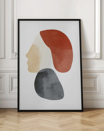 A minimalist abstract artwork in a black frame, featuring overlapping shapes that form a stylized human profile. The face is a light beige, topped with a rust-red shape like hair, and a dark grey, stone-like shape is positioned below the chin, all on a white background. Artwork