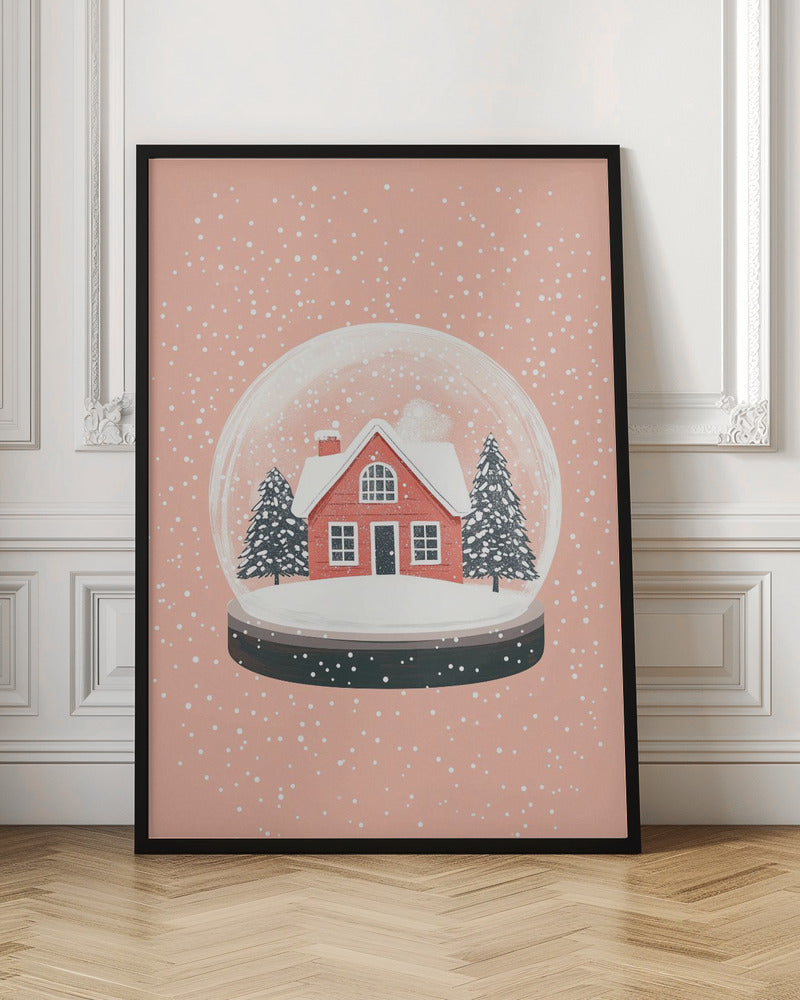 A charming illustration of a snow globe with a red house and two pine trees inside, all covered in snow. The snow globe is set against a soft pink background with white dots falling like snow, enclosed in a thin black frame. Poster
