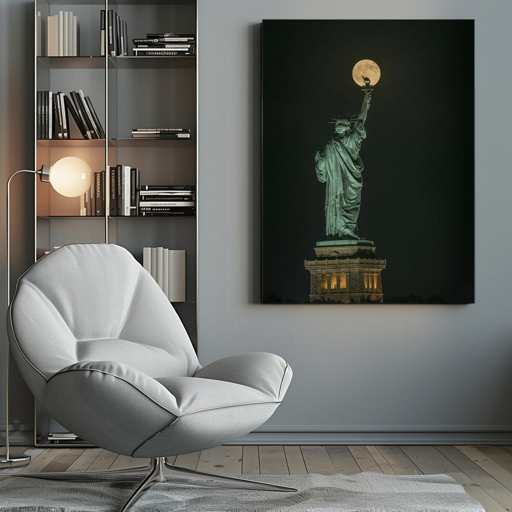 A striking night photograph of the Statue of Liberty, where a large, full yellow moon is perfectly aligned behind the torch, creating the illusion that the statue is holding up the moon. Artwork