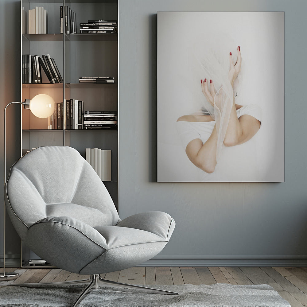 A minimalist photograph of a person in a white t-shirt against a white background, their face hidden by a sheer white veil. Their hands, adorned with bright red nail polish, frame the veiled face in an expressive pose. Wall Art
