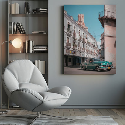 A vintage teal-green classic car sits on a sunny street in a historic city, possibly Havana, Cuba. Weathered apartment buildings with intricate balconies and hanging laundry line the street, with a peach-colored church tower visible in the background against a clear turquoise sky. Poster