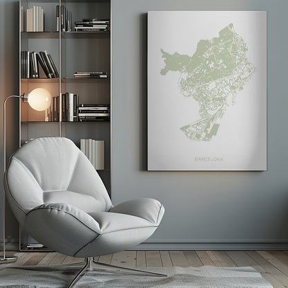 A minimalist art print of a Barcelona city map, rendered in a pale sage green on a white background. The print is framed in a simple black frame, with the city's name 'BARCELONA' typed at the bottom. Poster
