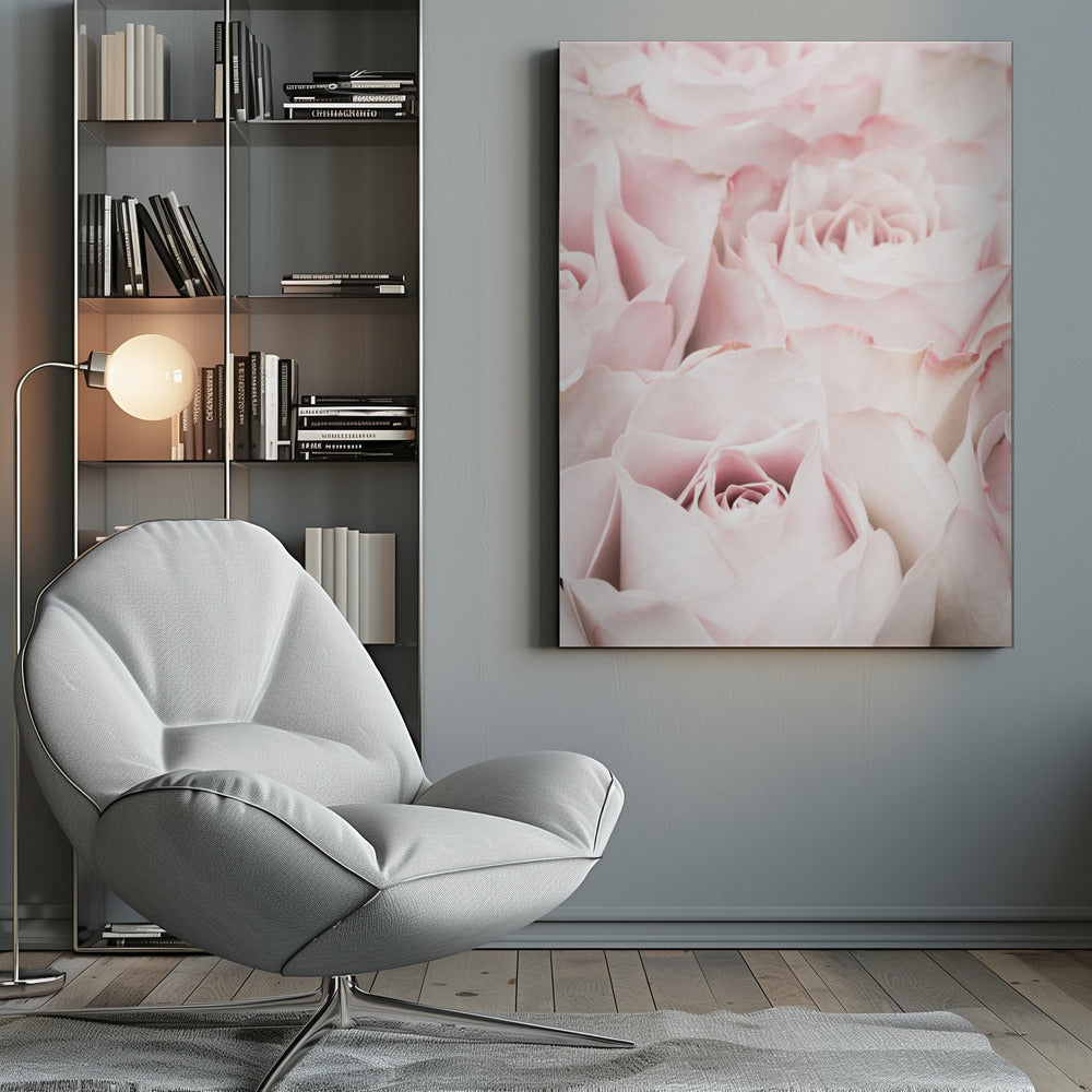 A close-up, soft-focus photograph of a bouquet of delicate, light pink roses filling the entire frame, enclosed in a simple black border. Poster