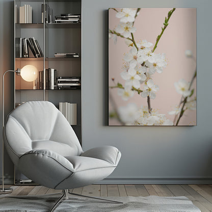 A close-up photograph of delicate white cherry blossoms with yellow stamens blooming on a thin branch against a soft pale pink background. The image has a shallow depth of field, focusing on the central cluster of flowers. Artwork