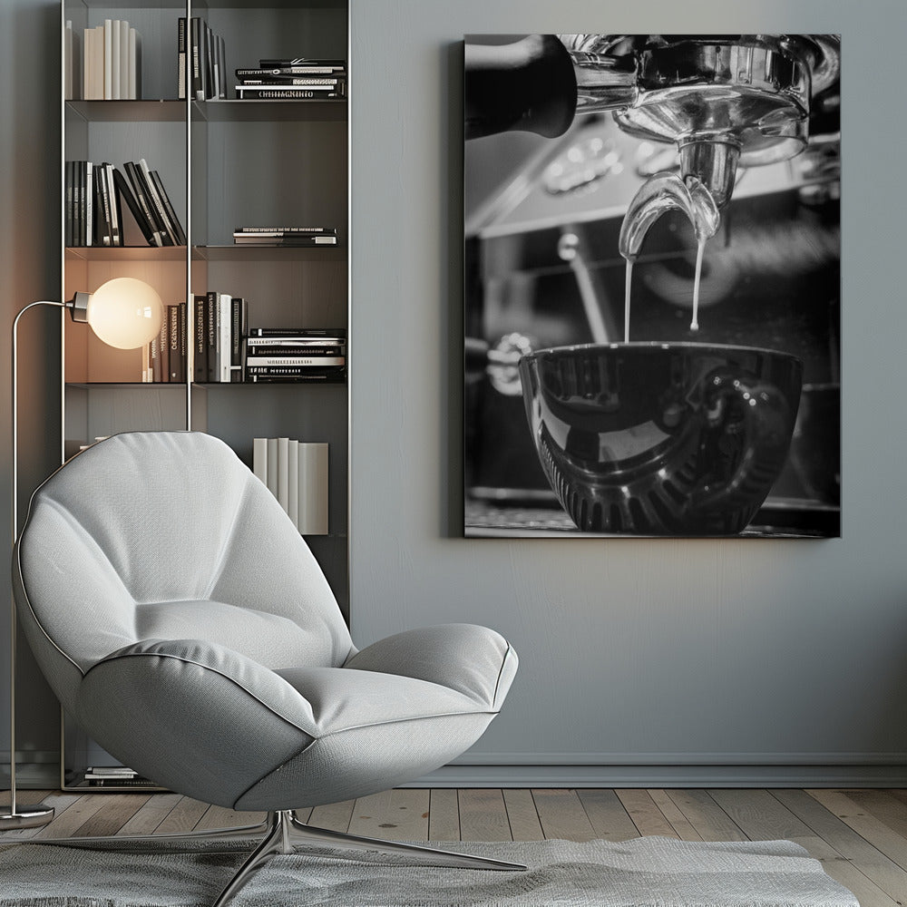 A close-up, black and white photograph of an espresso machine pouring two streams of fresh coffee from a chrome portafilter into a dark, glossy cup. Print