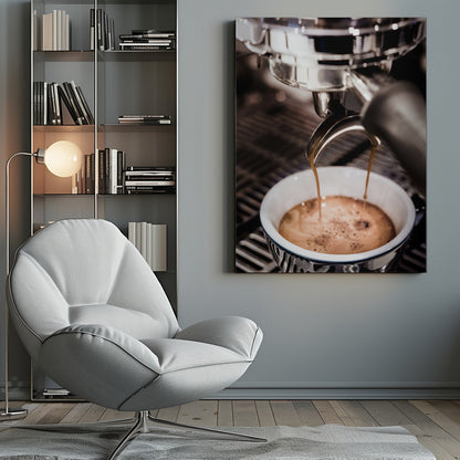 A close-up photograph of a shiny chrome espresso machine brewing a fresh shot of espresso. Two streams of rich, dark coffee pour from the portafilter into a white ceramic cup with a blue patterned rim, creating a light brown crema on top. Print