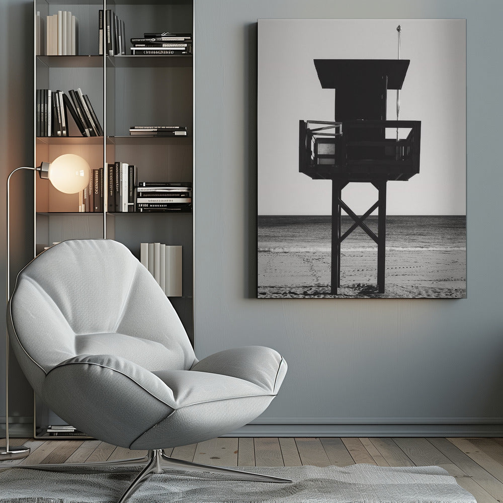 A high-contrast, black and white photograph of a silhouetted lifeguard tower standing on a sandy beach. The tower is centrally framed against a bright, empty sky, with the ocean and horizon visible in the background. Wall Art
